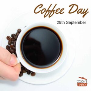 Cup of coffee with coffee beans on the side