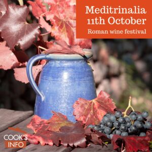 Wine jug with grapes