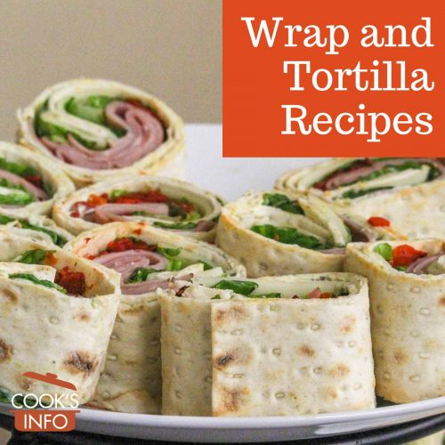 Sandwich wraps sliced into pieces on a plate